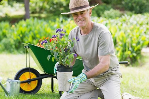 Gardener working alone with check-in device